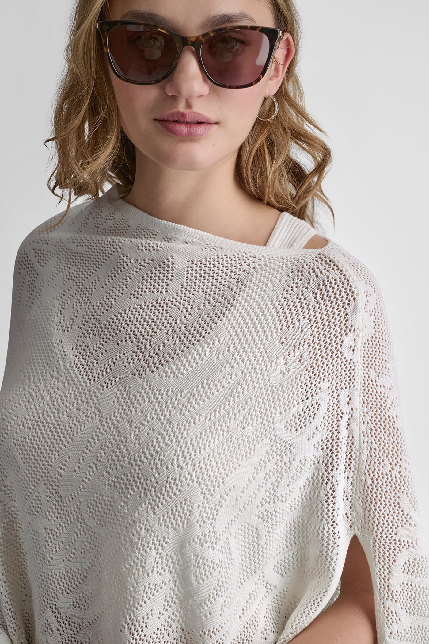 ASYMMETRIC LOGO POINTELLE PONCHO
